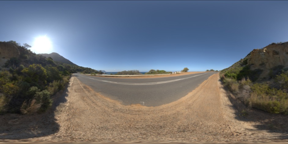 The same strip rendered: buildings and trees streaked outward, road markings smeared toward the vanishing point.